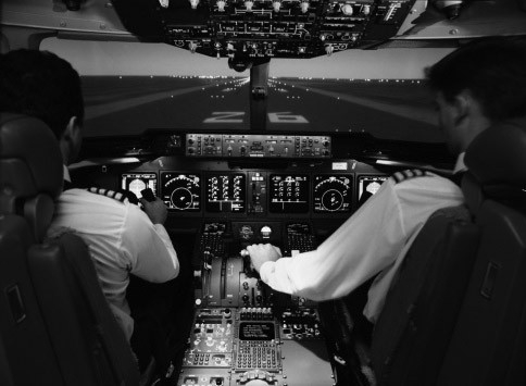 Photo of pilots in a cockpit