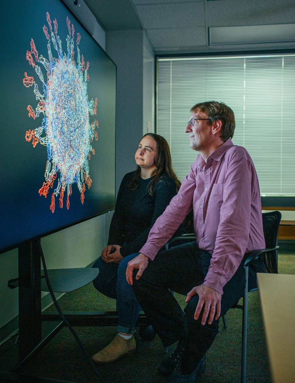 Photo of virologist Jan Carette (right), and graduate student Christine Peters, by Timothy Archibald