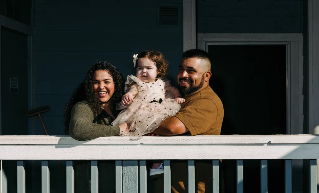 Noemi and Ellis Garcia at home with their daughter Lydia.