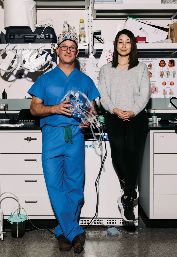 Neurointerventional surgeon Jeremy Heit, MD, PhD, left, and mechanical engineer Renee Zhao, PhD, are testing a device, called a milli-spinner, that rapidly twirls blood clots in patients, shrinking them to a fraction of their size so they can easily be removed.