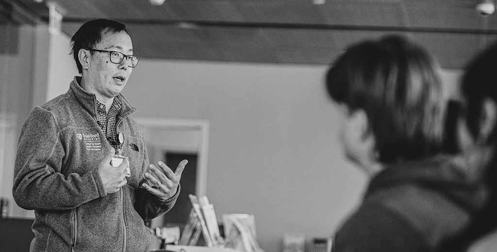 Photo of Bryant Lin at Stanford Health Library in the Stanford Hospital.