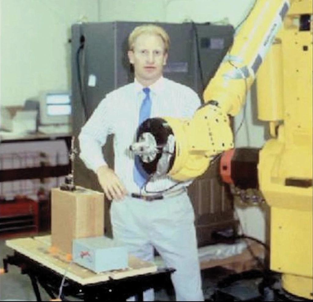 A photo of an early version of the CyberKnife, with inventor John Adler, MD